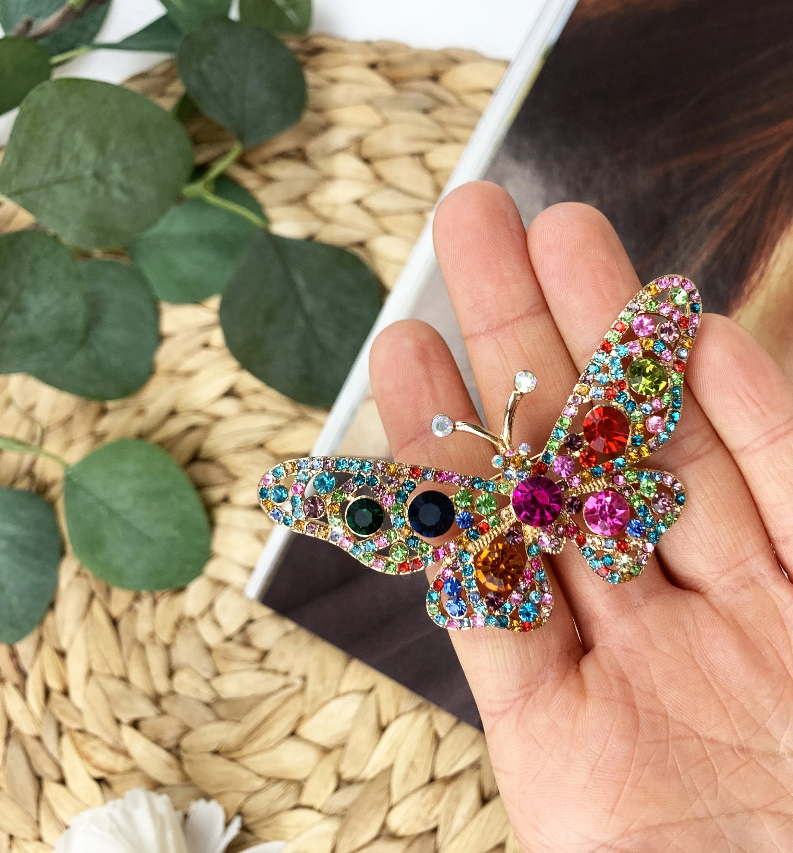 Butterfly brooch with colored zircons