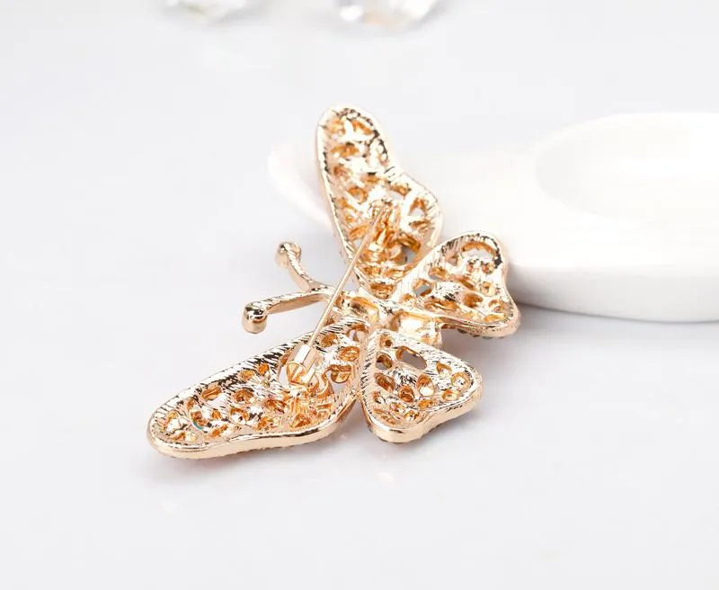 Butterfly brooch with colored zircons
