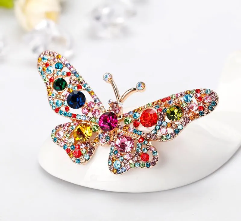 Butterfly brooch with colored zircons