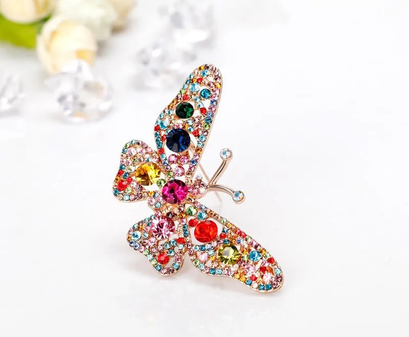 Butterfly brooch with colored zircons