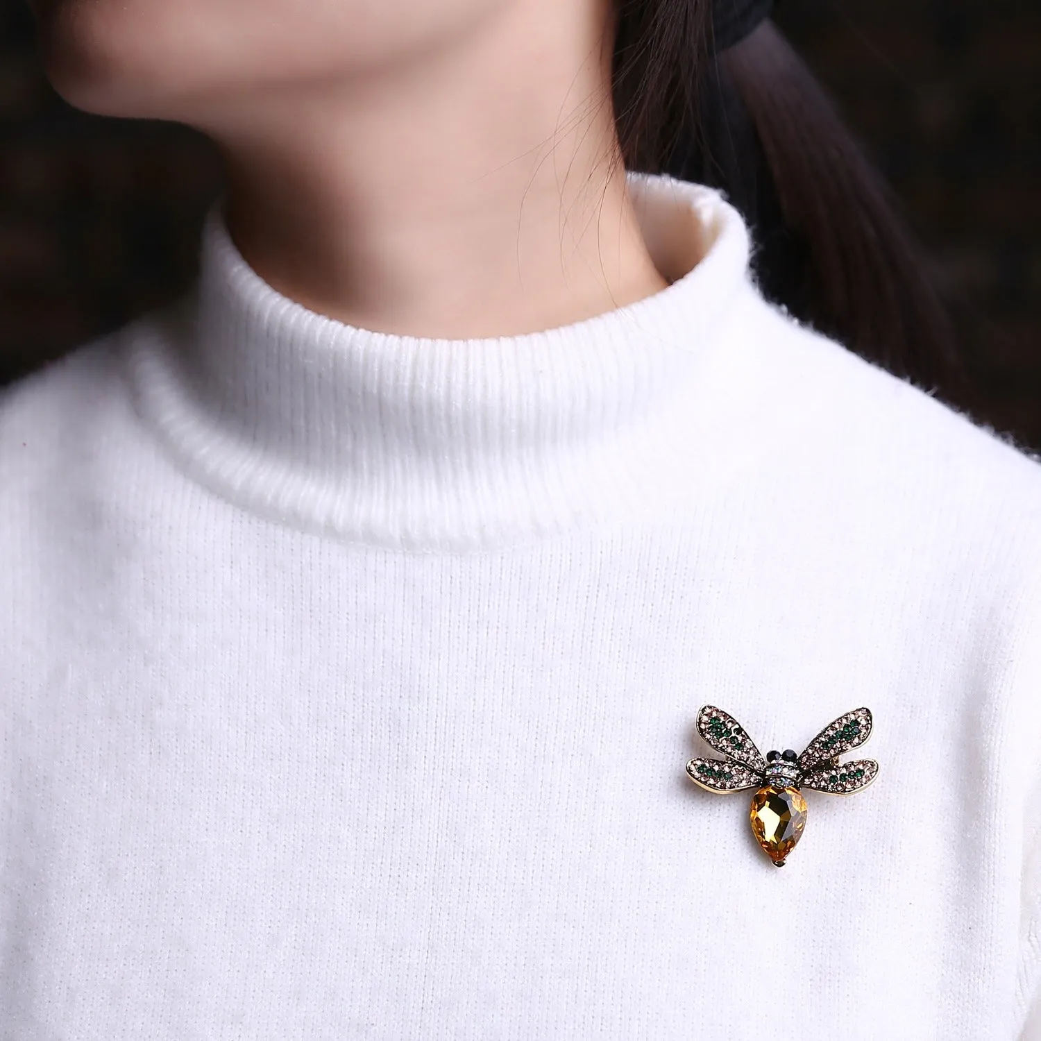 Yellow insect brooch with zircons