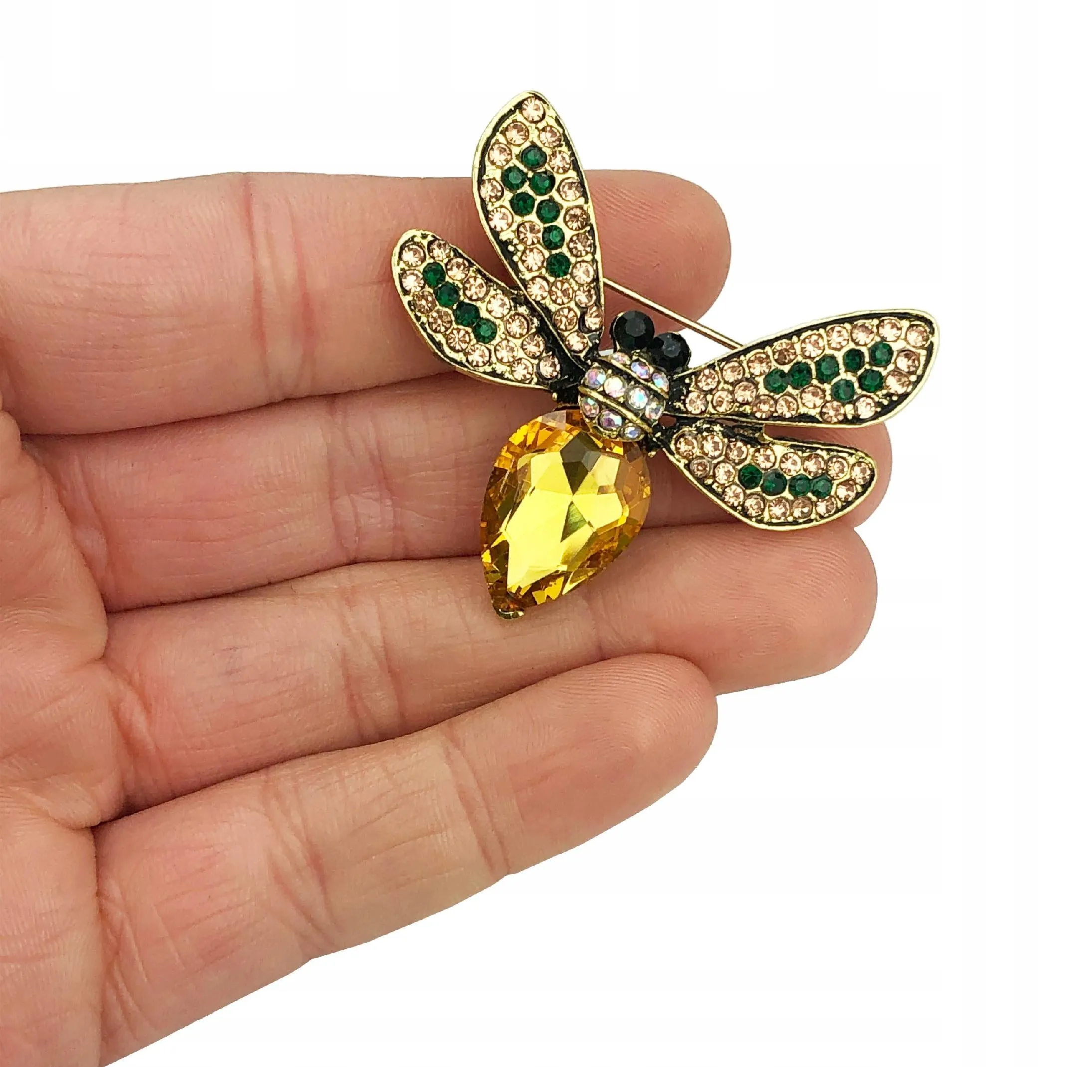 Yellow insect brooch with zircons