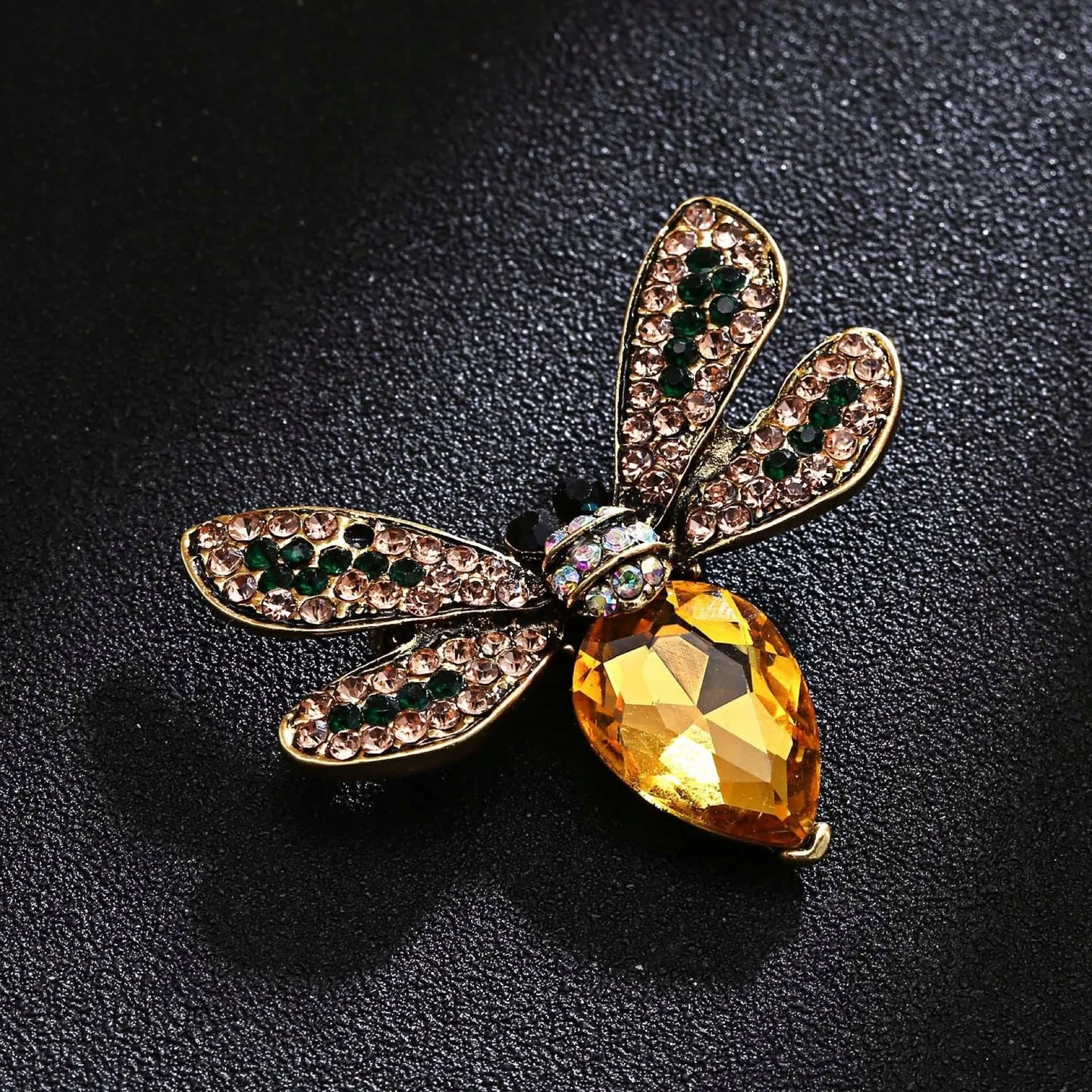 Yellow insect brooch with zircons